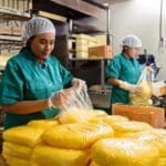 Firefly female workers are packing cheese into bags 9550-Putino-Food